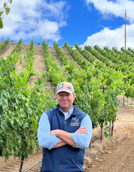 Bret Munselle in front of a Munselle vineyard.